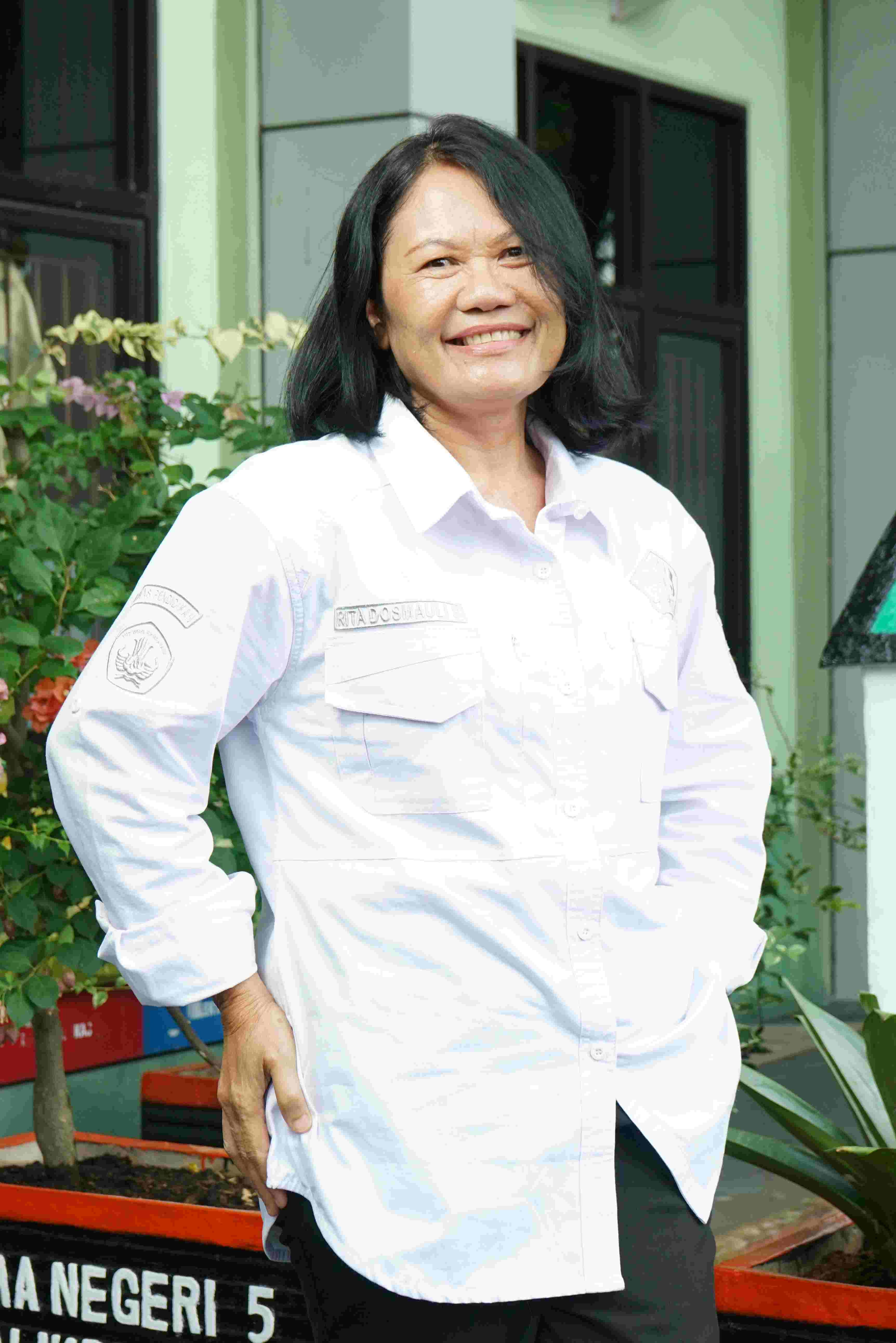 Rita Dosmauli Sihombing, S.Pd., M.M.Pd.